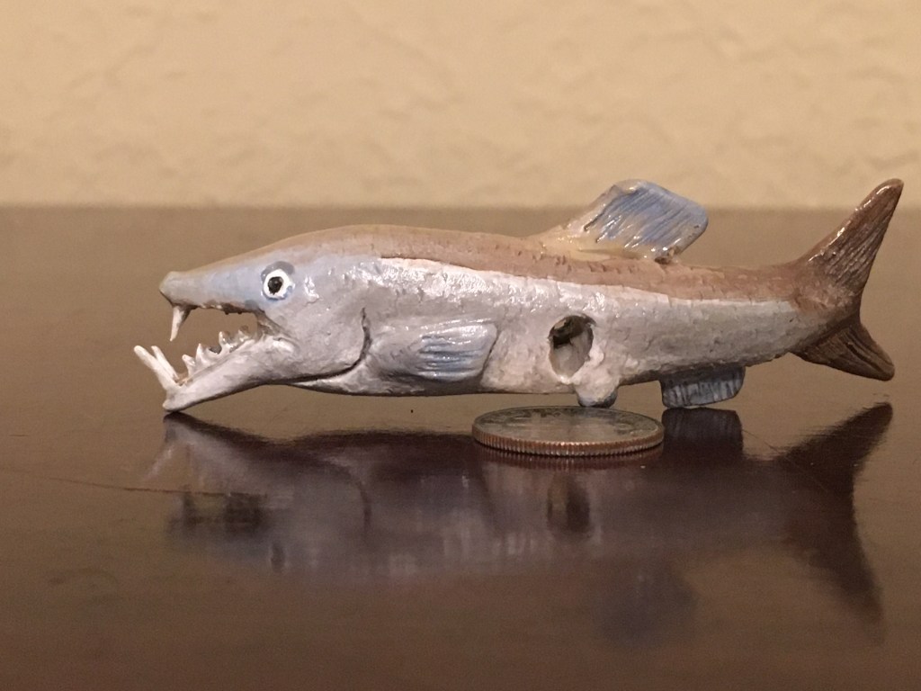 My tiny Enchodus sculpture has a hole in its side, whatever for?